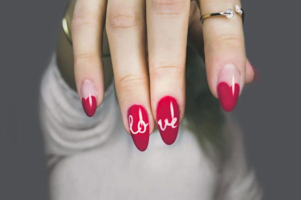 hearts and "love" written on fingernails for valentine's day or any time of the year