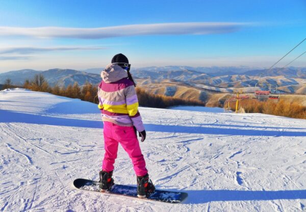 snowboarding with striped ski jacket